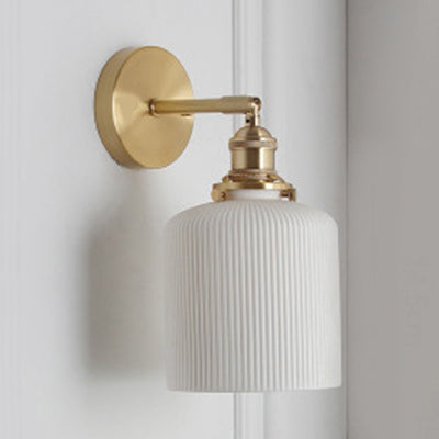 Elegant White Wall Sconce with Brass Accent