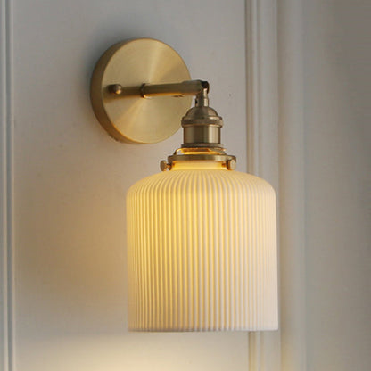 Elegant White Wall Sconce with Brass Accent