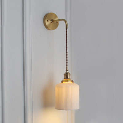 Elegant White Wall Sconce with Brass Accent