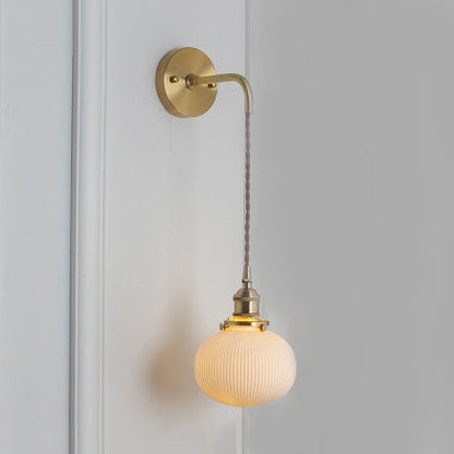 Elegant White Wall Sconce with Brass Accent
