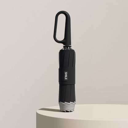 Compact Umbrella with Secure Buckle Closure