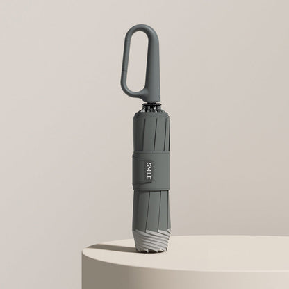 Compact Umbrella with Secure Buckle Closure