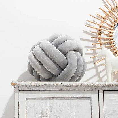 Plush Cushion with Knotted Suede Ball Accent